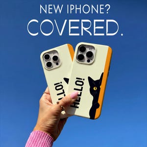 May include: Two off-white iPhone cases with black cat graphics and the word "HELLO!" in black. The cases have a yellow stripe on the side and are held against a blue sky. The text "NEW IPHONE? COVERED." is at the top.