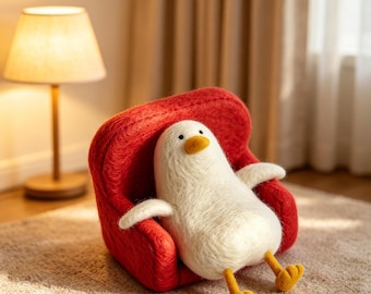 Handmade Felt Duck Figurine on Red Sofa – Wool Needle-Felted Desk Buddy