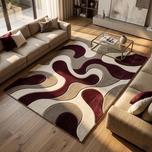 Könnte beinhalten: Ein rechteckiger Teppich mit einem großflächigen abstrakten Muster aus ineinandergreifenden organischen Formen in tiefem Burgunderrot, warmem Beige und Cremetönen. Das Design besteht aus fließenden, geschwungenen Linien.
