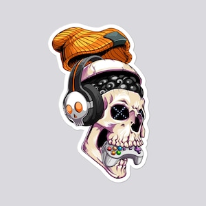 May include: A sticker featuring a skull wearing an orange beanie, black and white headphones, and holding a video game controller. The skull has a black eye design and a detailed bone structure. The overall design has a gaming theme.