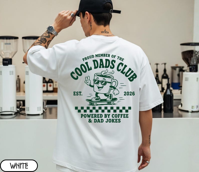 Comfort Colors 1717 White t-shirt on male model featuring a colored Cool Dads Club coffee mug Powered by Coffee graphic, soft unisex fit, garment dyed cotton texture, vintage washed tee for personalized dad gifts, Father's Day shirts, family style.