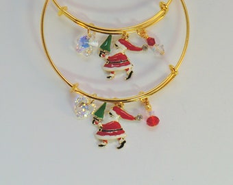 Santa tree bangles, Christmas gold bangles, enamel Santa red white and green. swarovski crystal flower and heart, Christmas holiday bangles