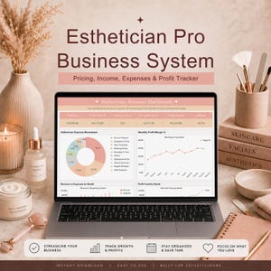 May include: A laptop displays an esthetician business dashboard with financial data, charts, and graphs. The screen is surrounded by skincare products, a candle, a vase with dried flowers, and books labeled "Skincare, Facials, Aesthetics."