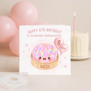 May include: A square birthday greeting card featuring a cute, iridescent pink dumpling character in a bamboo steamer basket. The text reads: HAPPY 6TH BIRTHDAY TO AN AMAZING GRANDDAUGHTER, HALLIE, and 6 TODAY. Two pink balloons and small stars surround the illustration.