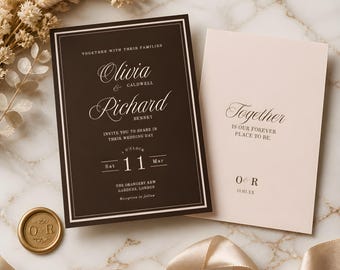 May include: A dark brown wedding invitation with white text and a cream-colored insert card featuring the text Together is our forever place to be. A gold wax seal with the initials O and R sits beside the cards, which are accented by a silk ribbon.