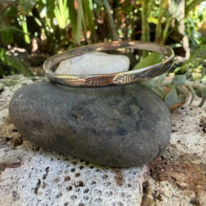 May include: A handmade wooden sign with the text "Welcome" in a playful font. The sign is painted white with a distressed finish, and features a small, decorative heart. It's designed for indoor or outdoor use.