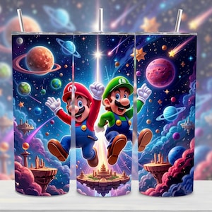 May include: A stainless steel tumbler featuring a vibrant, colorful design of Mario and Luigi in a space-themed setting. The artwork includes planets, stars, and a bright central light source. The tumbler has a straw and a lid.