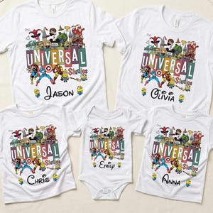 May include: White t-shirts and a onesie featuring a colorful Universal Studios graphic with various cartoon characters. The shirts are personalized with names: Jason, Olivia, Chris, Emily, and Anna. A family-themed apparel set.