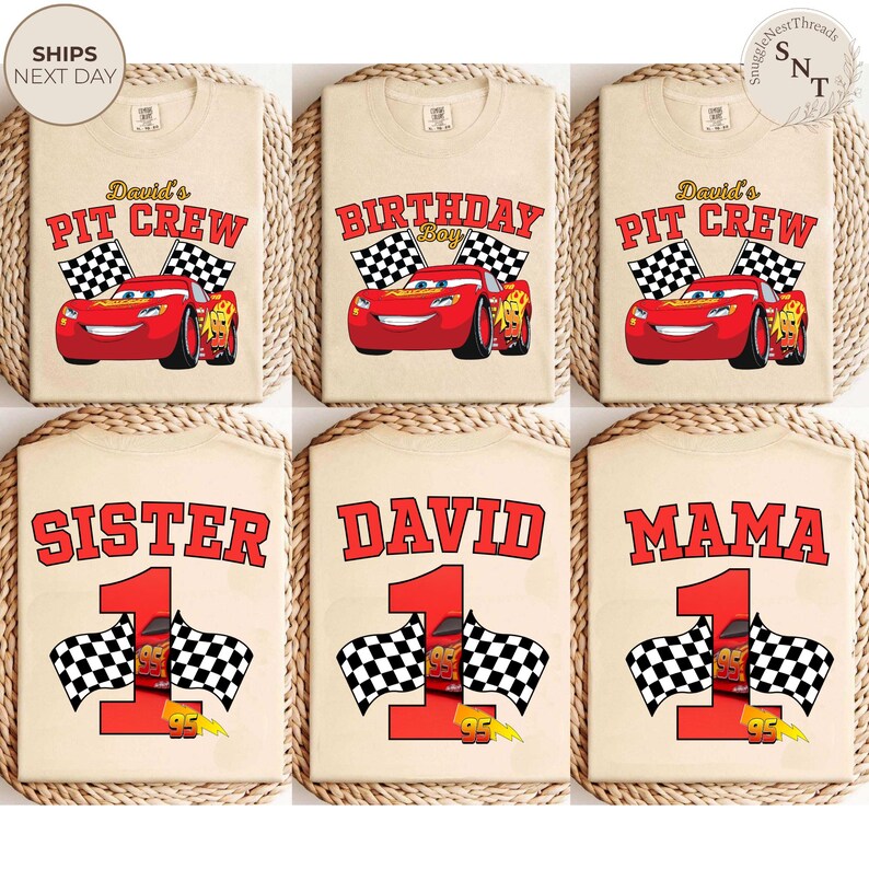 May include: Beige t-shirts with various designs featuring the character Lightning McQueen from the movie Cars. Designs include "David's Pit Crew", "Birthday Boy", "Sister", "David", and "Mama", with checkered flags and the number 1.