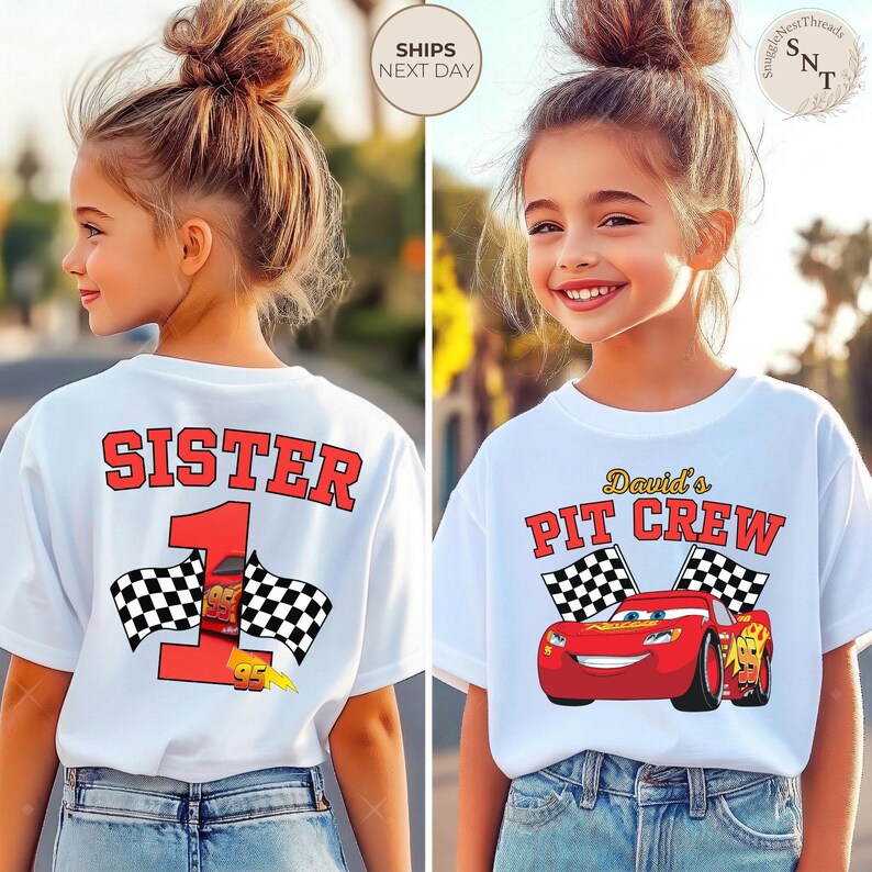 May include: White t-shirts with racing-themed graphics. One shirt says "SISTER 1" with checkered flags and a race car. The other says "David's PIT CREW" with a red race car and checkered flags. Both shirts are worn by a young person.