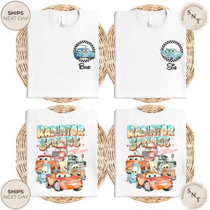 May include: White t-shirts with car-themed graphics. Two shirts feature a blue car in a checkered circle with "Bro" and "Sis" text. The other two shirts display a colorful "Radiator Springs" design with various car characters.