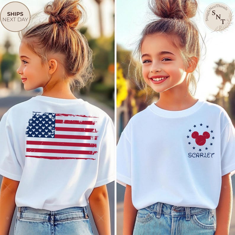 May include: White t-shirts with patriotic designs. One shirt features a distressed American flag on the back. The other has a Mickey Mouse head with stars and the name "Scarlet". Both shirts are worn by a young person.
