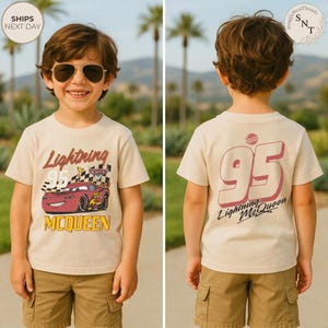 May include: A beige Lightning McQueen t-shirt with a graphic of the race car and the number 95. The front of the shirt has the text "Lightning McQueen" and "McQueen". The back of the shirt has a large number 95 and "Lightning McQueen".