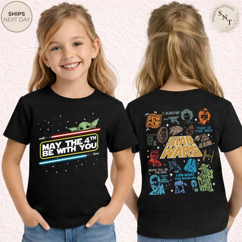 May include: Black t-shirt featuring a graphic of Baby Yoda and the text "May the 4th Be With You" with lightsabers. The back of the shirt has Star Wars characters and quotes. A fun tee for Star Wars fans.