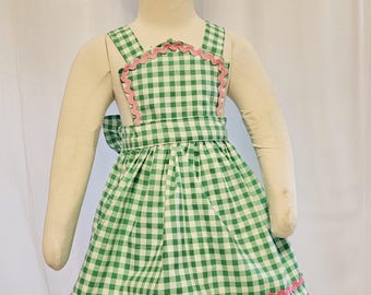 Green gingham jumper and bow size 2
