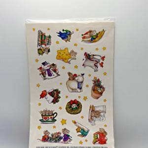 May include: A sheet of Christmas-themed stickers featuring various illustrations of mice, a snowman, a polar bear, and a wreath, all accented with small yellow stars. The bottom text reads: CODE 29388 WEE BLESSINGS © CURRENT, COLORADO SPRINGS, CO 80941 PRINTED IN THE U.S.A.
