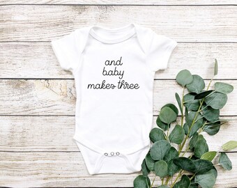 Baby Announcement Onesie® And Baby Makes Three Onesie® Pregnancy Announcement Onesie® Surprise Reveal Onesie® Baby Coming Soon Onesie