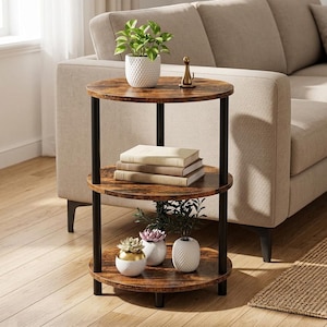 May include: A three-tier round side table with a dark brown wood grain finish and black metal support poles. The top shelf holds a small green plant in a white textured pot and a cat figurine. The middle shelf holds three books. The bottom shelf holds three small potted plants.