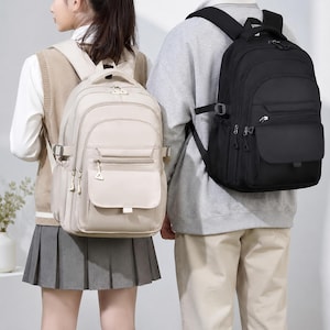 Mochila impermeable con múltiples bolsillos, ideal para la escuela, la universidad o el portátil.