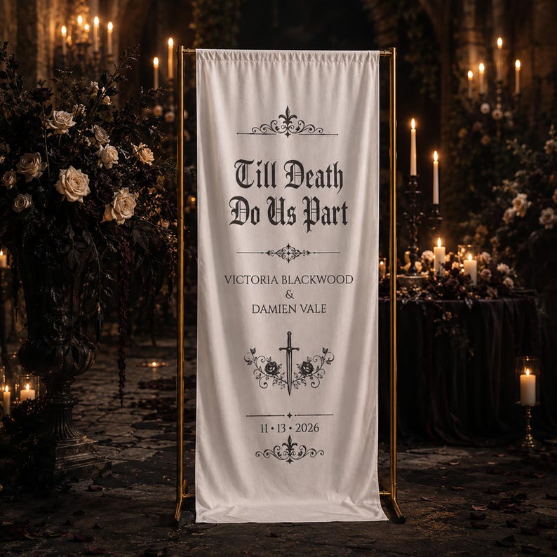 May include: A cream-colored wedding banner with gold-colored poles. The banner reads "Till Death Do Us Part" with the names Victoria Blackwood & Damien Vale and the date 11.13.2026. The banner has decorative floral and sword designs.