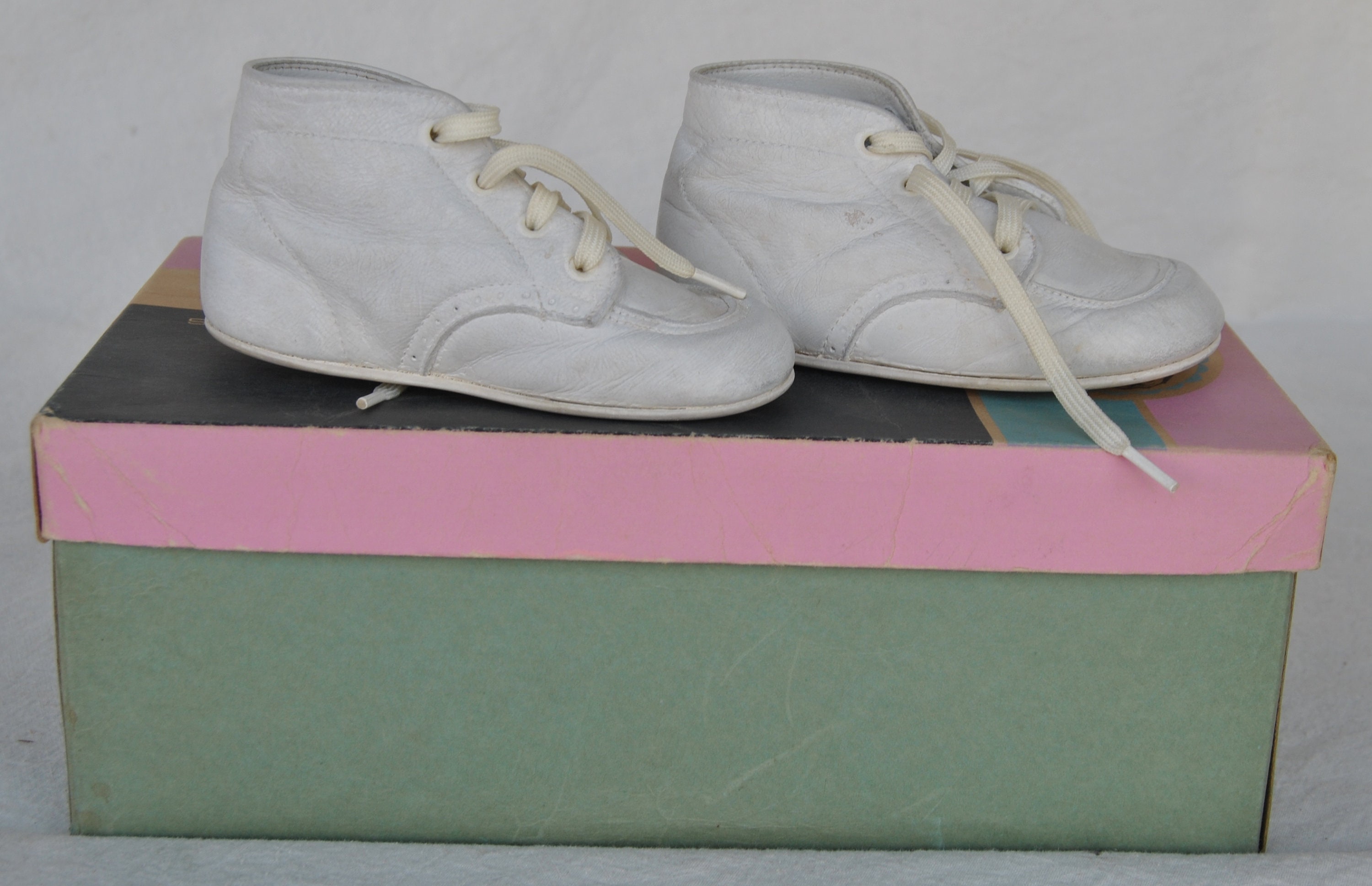 white hard bottom baby shoes