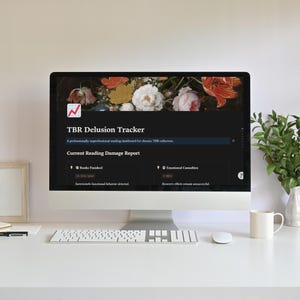 May include: A computer monitor displaying a digital dashboard titled TBR Delusion Tracker with a floral header. The screen shows sections for Books Finished and Emotional Casualties, with text including A professionally unprofessional reading dashboard for chronic TBR collectors and Current Reading Damage Report.