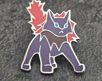 May include: A purple and red enamel pin depicting a stylized cat-like creature with blue eyes. The pin has a silver outline and a detailed design, ideal for adding a unique touch to clothing or accessories.