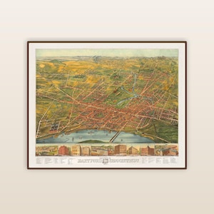 Puede incluir: Un mapa vintage enmarcado de Hartford, Connecticut, de 1874. El mapa presenta una vista aérea detallada de la ciudad, con edificios, calles y un río. El mapa está en tonos de verde, marrón y rojo, con un marco marrón.