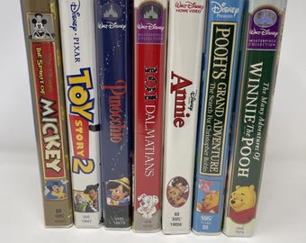 Lot 7 Great Classic Walt Disney Clamshell VTG VHS Bonus Disney ephemera/Iron On