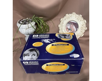 Cámara digital HP PhotoSmart C200, modelo vintage de 1999, en caja original, sin probar, tal cual.