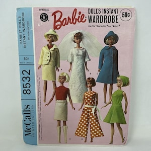 May include: A vintage Barbie doll's instant wardrobe pattern, featuring various outfits for a 11.5-inch doll. The cover displays Barbie dolls in different outfits, including a suit, a wedding dress, and a coat. The pattern is from McCall's.