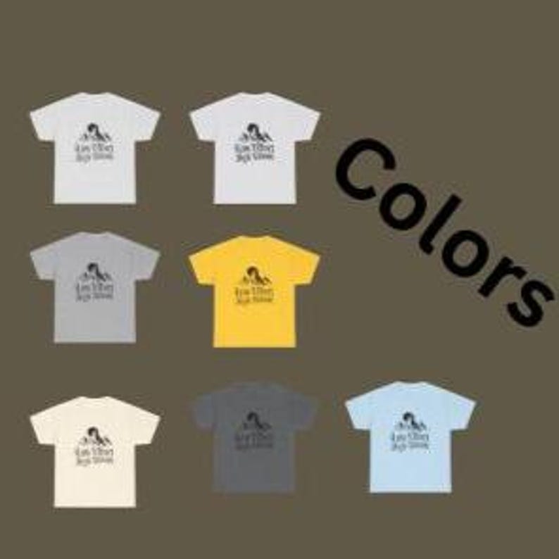 May include: A collection of t-shirts in various colors, including white, gray, yellow, and blue. Each shirt features a graphic and the text "Kimberly High School". The shirts are displayed against a brown background with the word "Colors" in black.