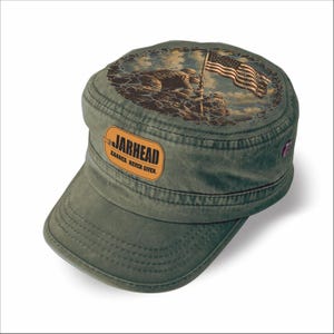 May include: An olive green military-style cap featuring a tan dog tag patch on the front with the text JARHEAD EARNED. NEVER GIVEN. The top of the cap displays a circular graphic of soldiers raising an American flag against a cloudy sky.