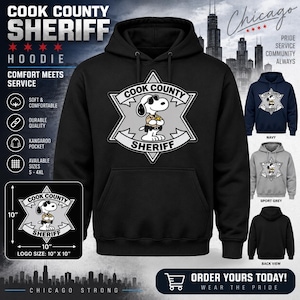 Op de afbeelding: Een zwarte hoodie met een afbeelding van een stripfiguurhond met zonnebril en sheriff-uniform in een stervormige badge met de tekst COOK COUNTY SHERIFF. Het ontwerp op de voorzijde van de hoodie meet 25,4 cm bij 25,4 cm.