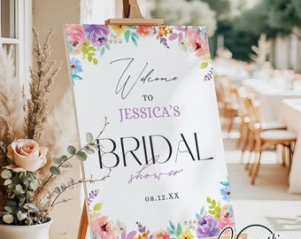 May include: A white welcome sign with floral borders and the text "Welcome to Jessica's Bridal Shower 08.12.XX".