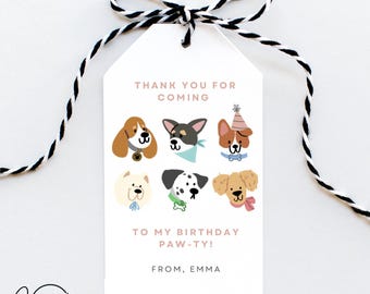 May include: White thank you tag with a pink border. The tag has a cartoon illustration of six dogs with different breeds and colors. The text on the tag reads "Thank you for coming to my birthday paw-ty! From, Emma".