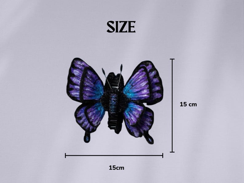 May include: A decorative butterfly with a wingspan of 15 cm (5.9 inches). The butterfly features a gradient of purple and blue hues on its wings, with a black body. The word "SIZE" is at the top of the image.