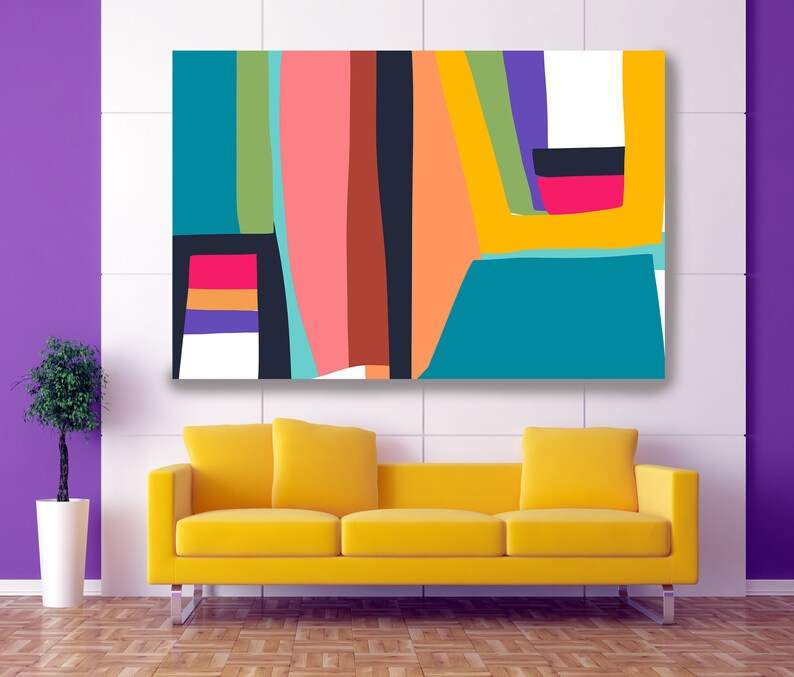May include: Abstract art canvas print featuring a vibrant composition of shapes and colors. The artwork includes teal, pink, orange, yellow, and black elements. A bright yellow sofa with chrome legs sits below the artwork, against a purple wall.