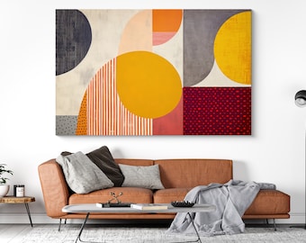 May include: Abstract geometric art print with a mix of yellow, orange, red, gray, and white colors. The print features a variety of shapes, including circles, squares, and stripes.