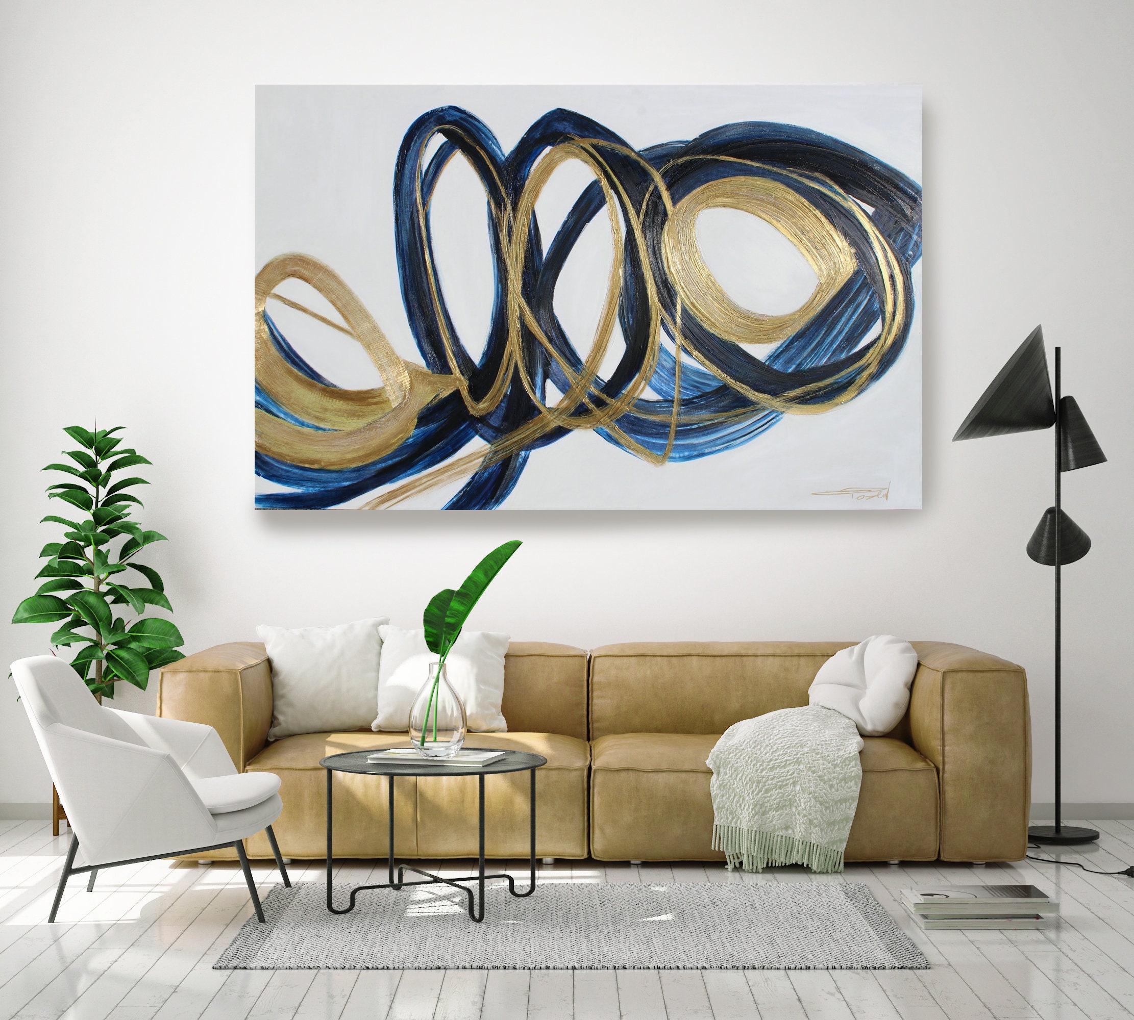 Round canvas painting in blue, gold and black