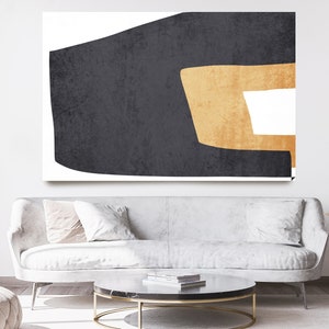 May include: Abstract art print featuring a large black shape with a smaller gold shape inside. The shapes are set against a white background.