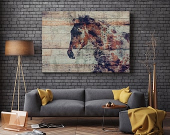 May include: A watercolor painting of a brown and white horse's head on a wooden background. The painting is framed and hanging on a brick wall above a gray couch with yellow throw pillows.