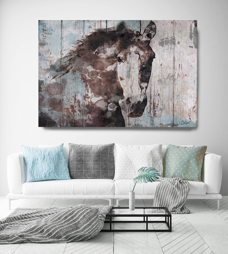 May include: A watercolour painting of a brown and white horse's head on a textured blue and brown background.
