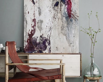May include: A watercolor painting of a horse's head with purple and red accents on a textured background. The painting is framed and hanging on a wall above a wooden chair and a glass vase with branches.