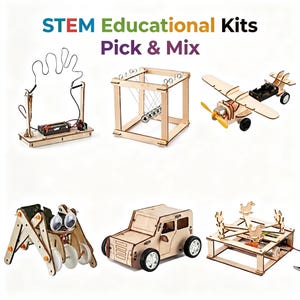 May include: A white ceramic mug with a black handle and the text "But First, Coffee" in a bold, black font. The mug is set against a blurred background. The mug appears to be approximately 10 cm tall.