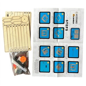 May include: A wooden science kit with laser-cut wooden pieces, a clear plastic bag containing gears and electronic components, and a printed instruction sheet with the word "STEPS".