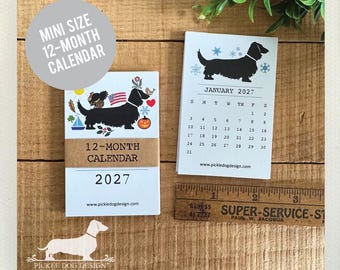 Calendario dell'Avvento 2027 con bassotto a pelo lungo: regalo perfetto per gli amanti del bassotto a pelo lungo, ideale come pensierino per le feste.