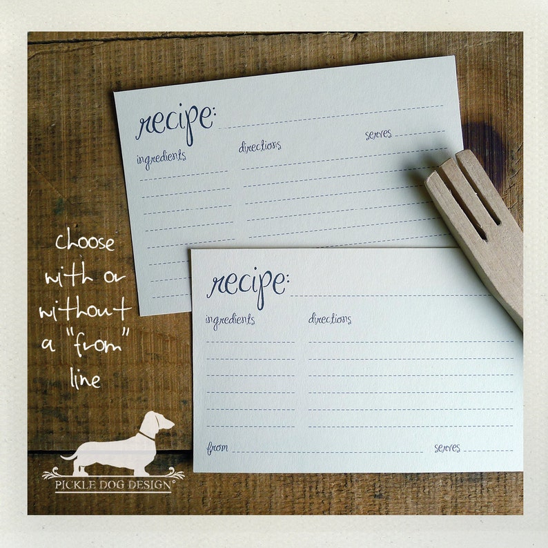 May include: Two light blue recipe cards with handwritten text, including "recipe," "ingredients," and "directions." One card has a "from" line. A wooden fork rests on the cards. The image also includes the text "choose with or without a "from" line" and a dog logo.