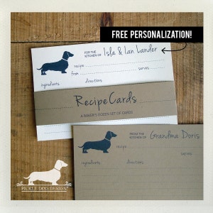May include: Recipe cards with a dachshund silhouette. The cards have lines for ingredients, directions, and servings. The text "Recipe Cards" and "A Baker's Dozen Set of Cards" are visible. The cards are personalized with names and the text "Free Personalization!"
