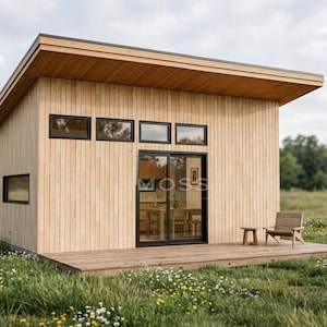 May include: A modern, light wood cabin with a flat roof and black-framed windows and sliding glass door. A small wooden deck extends from the front, with a chair and small table. The cabin is set in a field of wildflowers.